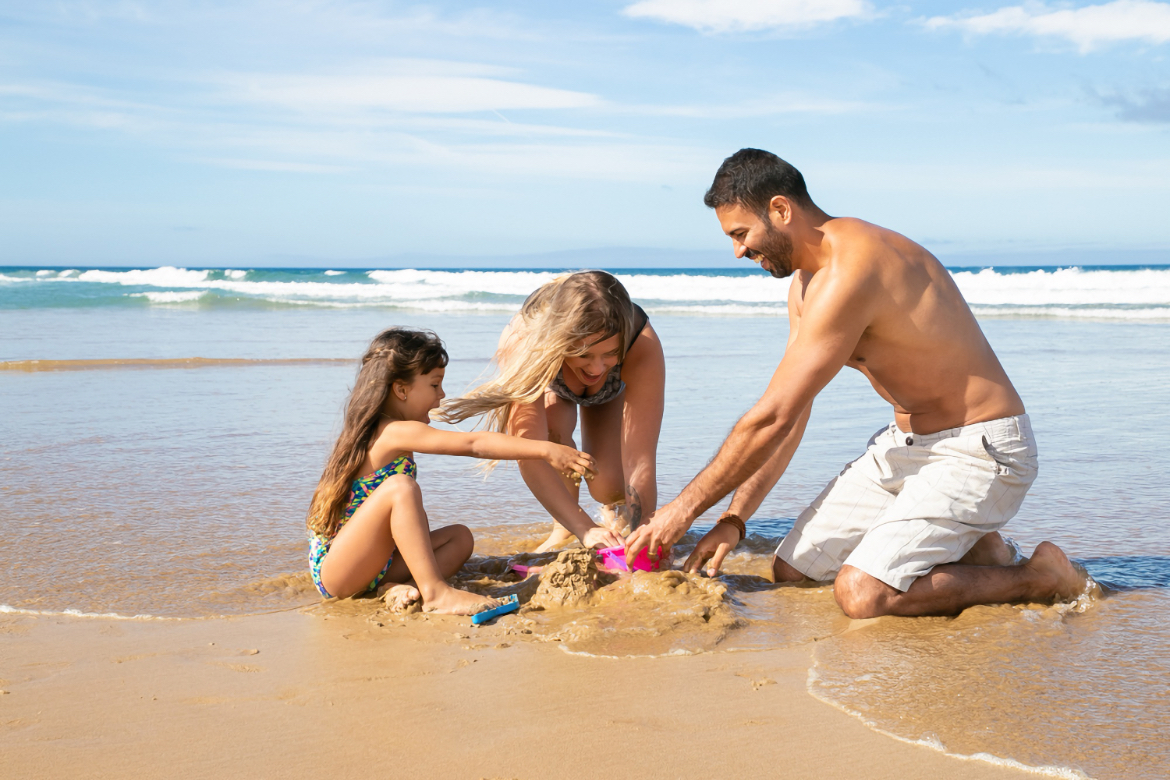 family enjoying the beach at grand velas riviera maya